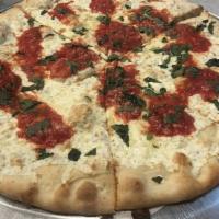 Margherita Pizza · Fresh mozzarella, tomato sauce, basil and olive oil.