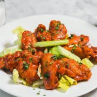 Buffalo Wings · Served with blue cheese and celery.