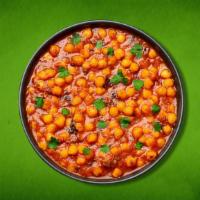 Savory Potato & Chickpeas (Vegan) · Whole chickpeas and potatoes, slow cooked in an onion and tomato curry with Indian whole spi...