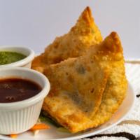 Vegetable Samosa · 2 pcs.  Golden crispy triangle pastry filled with mildly spiced potatoes and peas.