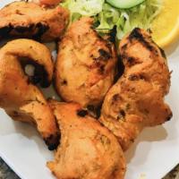 Tandoori Chicken Tikka · Pieces of dark meat marinated in a spicy yogurt-based mixture traditionally cooked in