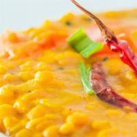 Daal Tadka · Vegetarian. Simmered yellow lentils tempered with ginger, garlic & cumin seeds.