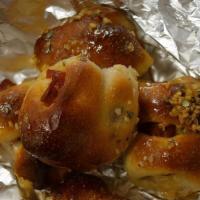 Pepperoni Garlic Knots · Knotted Dough Wrapped With Beef Pepperoni, Garlic, Basil & Olive Oil. Comes With A Side Of M...