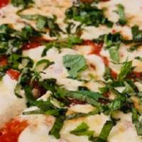Margherita · Fresh mozzarella, tomato sauce, basil and Parmesan cheese.