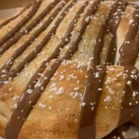 Nutella Calzone · Half-moon shaped pocket of dough stuffed with nutella.