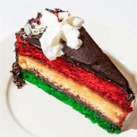 Rainbow Cake Slice · Three Colorful Sponge Cake Layers Filled With A Sweet Raspberry Jam And Almond Marzipan. Top...