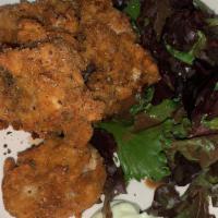Fried Oysters · Fresh deep-fried oysters served with a mixed green salad.