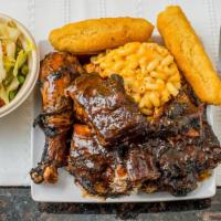 Jerk Chicken (Bone-In) · Authentic juicy jerk chicken served with a choice of any 2 Sides.