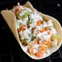 Buff Chick · Shredded buffalo chicken, celery carrot cabbage slaw, blue cheese crumbles, housemade ranch.