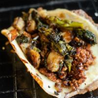 Gino · Melted mozzarella, hot Italian sausage, sautéed broccoli rabe, long hot and potato mixture, ...