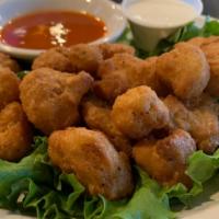 Cauliflower Bites · lightly breaded and delicious.  PLEASE specify plain or buffalo. Both served with blue chees...