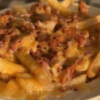 Loaded Fries · With chili & cheddar cheese.