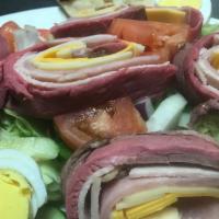 Chef Salad · Julienne of roast beef, ham, turkey, swiss & American cheese  over tossed greens with hard b...