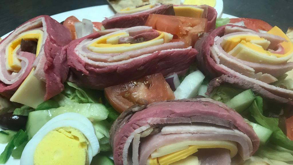Chef Salad · Julienne of roast beef, ham, turkey, swiss & American cheese  over tossed greens with hard boiled egg & tomato.