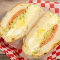 Chive Egg Salad Sandwich · With cucumber, carrot, sprouts, and tomatoes, and leaf lettuce on an 8-grain bread.