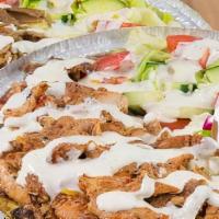 Chicken Gyro Over Rice · Chunks of Chicken  on Rice with Lettuce, Tomato, Onion, Green peppers & Gyro sauce