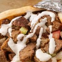 Lamb Gyro Wrap · Chunks of Lamb wrapped in Gyro bread with Lettuce, Tomato, Onion, Green peppers,  & Gyro sauce