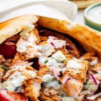 Chicken Gyro Wrap · Chunks of Chicken wrapped in Gyro bread with Lettuce, Tomato, Onion, Green peppers,  & Gyro ...