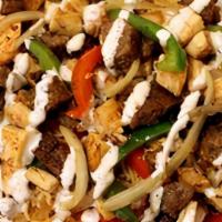 Lamb Gyro Over Rice · Chunks of Lamb on Rice with Lettuce, Tomato, Onion, Green peppers & Gyro sauce