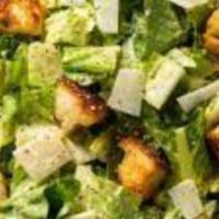 Caesar Salad · Crispy romaine lettuce, croutons, shaved romano cheese, and caesar dressing.