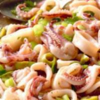Calamari Salad · Crispy romaine lettuce, poached calamari, extra virgin olive oil, lemon juice, and spices.