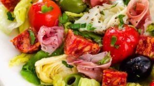 Antipasto Salad · Spring greens, mortadella, ham, salami, provolone, tomatoes, cucumbers, onion, and giardinie...