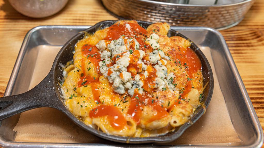 Buffalo Mac · baked macaroni smothered in our house cheese sauce, with crumbled bleu cheese and Wenzel buffalo