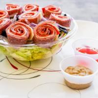 Italian Salad · Romaine, salami, pepperoni, provolone, black olives & onions.