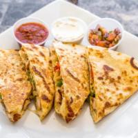Grilled Chicken Quesadilla · Peppers, onions & blended cheese on a flour tortilla.