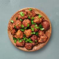 Chicken Pakora · Chicken batter-fried to perfection in traditional Andhra style and seasoned with herbs.