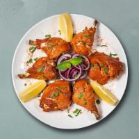 Old Delhi Chicken Tandoori · Chicken wings gently kneaded with herbs and perfectly baked in a clay oven.