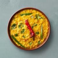 Yellow Lentils  · Slow-cooked lentils tempered with herbs and whole red chillies. Served with a portion of aro...