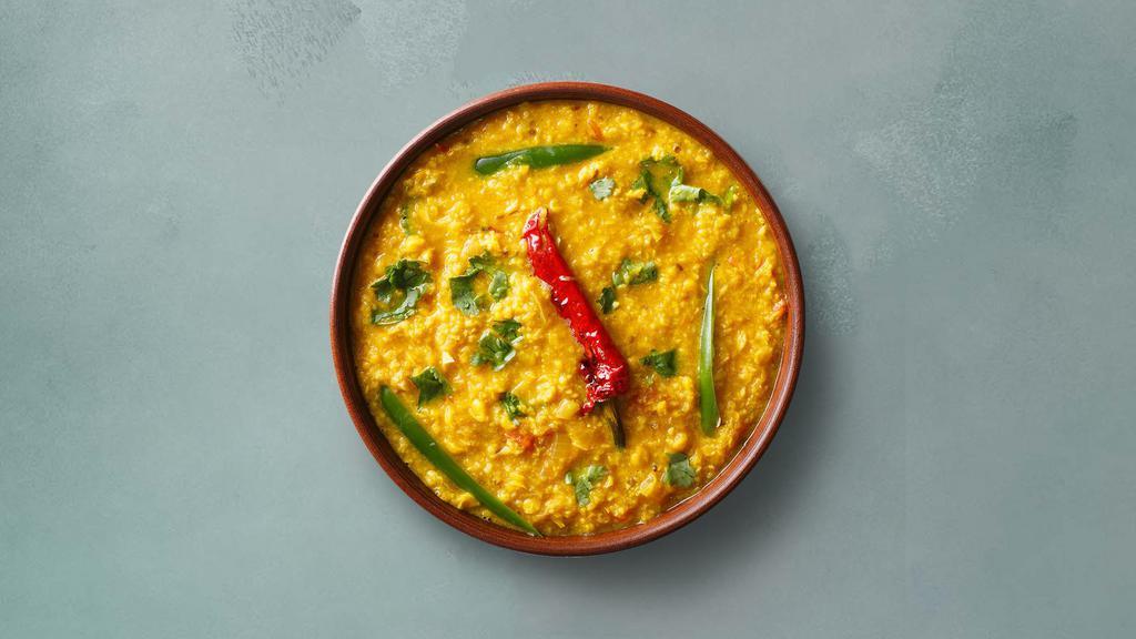 Yellow Lentils  · Slow-cooked lentils tempered with herbs and whole red chillies. Served with a portion of aromatic basmati rice.