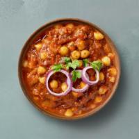 Garbanzo Masala · Chickpeas cooked with farm-fresh vegetables and special herbs. Served with a portion of arom...