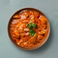 Tangy Chicken Tikka Masala · Oven-roasted chicken chunks in a rich creamy tomato and onion based gravy. Served with a por...