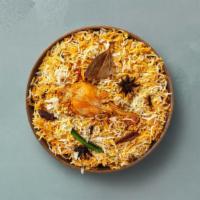 Spice Lane Chicken Biryani · Long grain basmati rice cooked with tender chicken and aromatic Indian herbs. Served with ra...