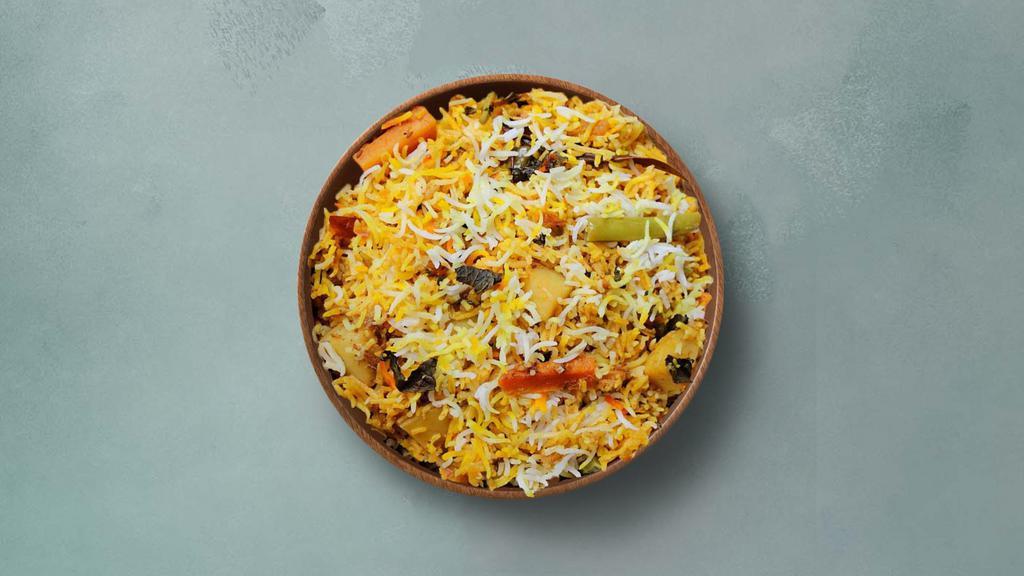 Spice Lane Veggie Biryani · Long grain basmati rice cooked with farm-fresh vegetables and aromatic Indian herbs. Served with raita.