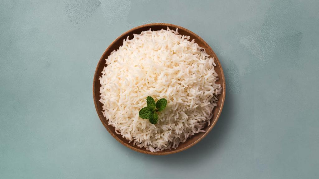 Steamed Rice · Steamed aromatic long grain white rice.