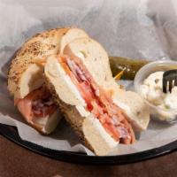 Nova Lox · Bagel with cream cheese, sliced red onions, tomato and capers.