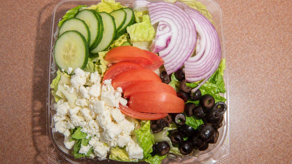 Greek Salad · Feta cheese, red onion, cucumber, tomato, and black olives over romaine lettuce.