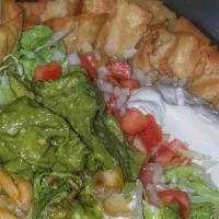 Taco Salad · Lettuce, black beans, cotija cheese, pico de gallo, avocado, strip chips, and chipotle dress...