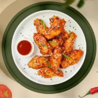Chili Glaze Wings · Fresh chicken wings fried until golden brown, and tossed in sweet chili sauce. Served with a...