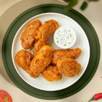 Habanero Heat Wings  · Fresh chicken wings, fried until golden brown, and tossed in mango habanero sauce. Served wi...