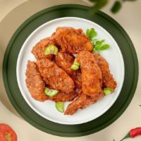 Hot Ville Wings  · Fresh chicken wings, fried until golden brown, and tossed in Nashville Hot Sauce. Served wit...