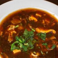 Chicken Hot And Sour Soup · Red chili, soy sauce, tofu, mushroom and cilantro. Hot and spicy.