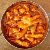 Chicken Chili Onion · Stir-fried chicken in a red chili sauce & green onion. Hot and spicy.