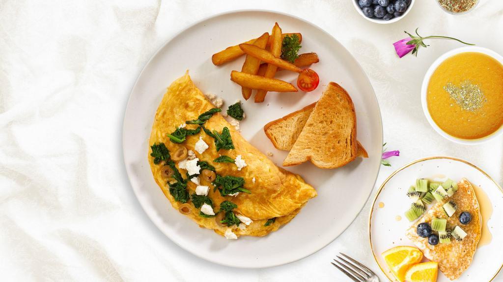 Greek God Omelette · Eggs cooked with Kalamata olives, feta cheese, and tomatoes as an omelette.