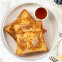 Classic French Toast · Fresh bread battered in egg, milk, and cinnamon cooked until spongy and golden brown. Topped...