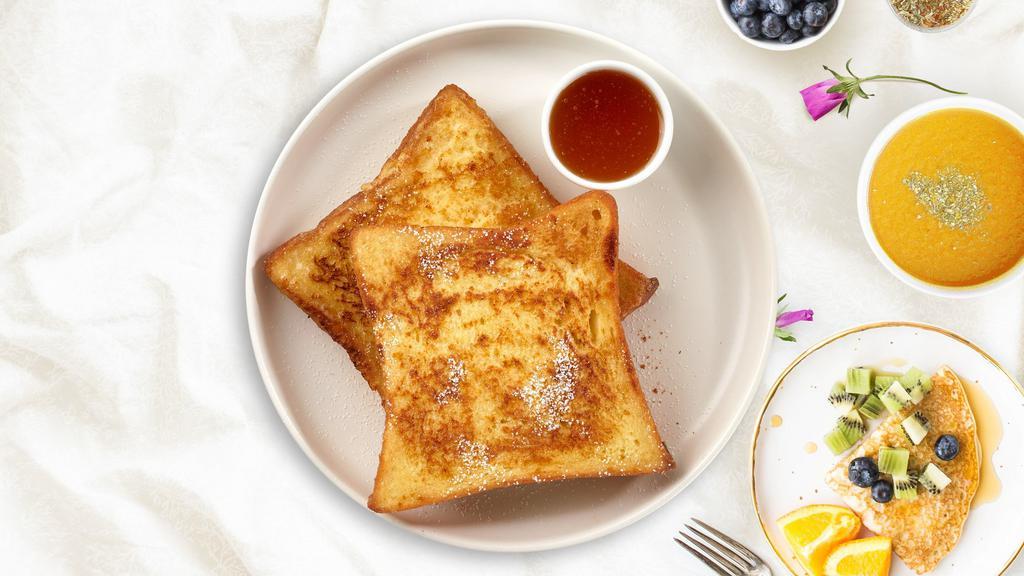Classic French Toast · Fresh bread battered in egg, milk, and cinnamon cooked until spongy and golden brown. Topped with powdered sugar, and served maple syrup.