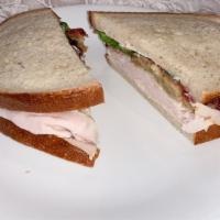 Thanksgiving Day · Roast turkey or pork, stuffing, cranberry sauce, lettuce and mayo on rye.